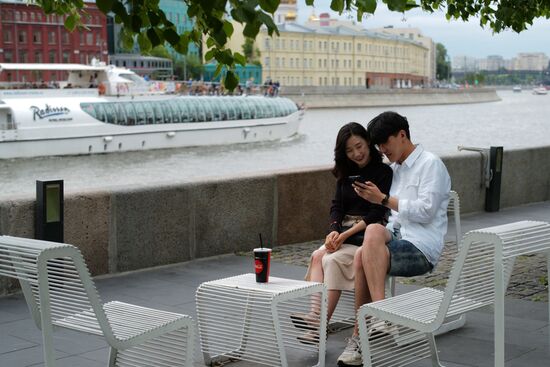 People relax at Museon arts park in Moscow