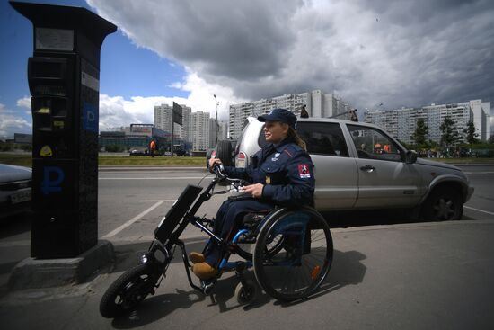 People with disabilities monitor parking lots