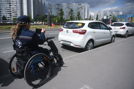 People with disabilities supervise parking