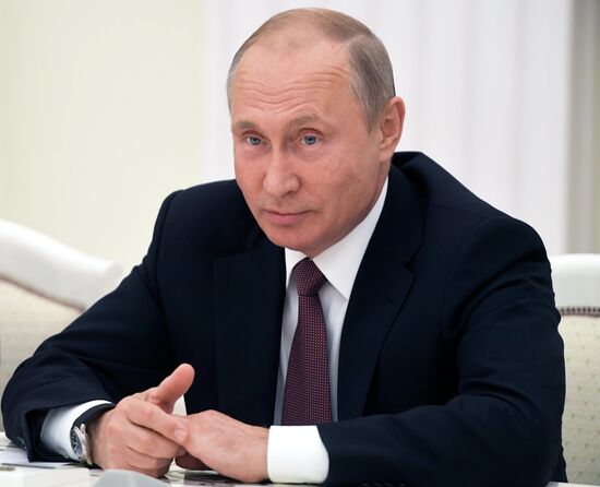 Russian President Vladimir Putin meets with US National Security Adviser John Bolton
