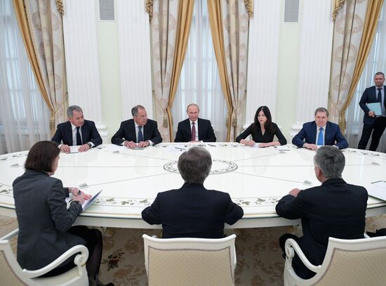 Russian President Vladimir Putin meets with US National Security Adviser John Bolton
