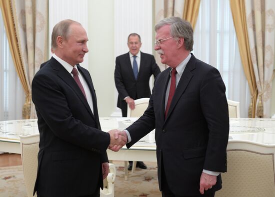 Russian President Vladimir Putin meets with US National Security Adviser John Bolton