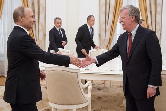 Russian President Vladimir Putin meets with US National Security Adviser John Bolton