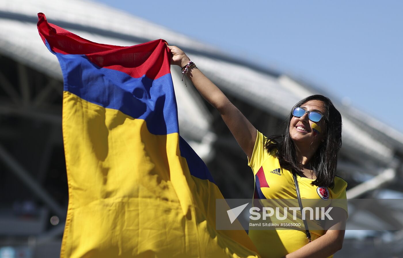 Colombia's fan cheers ahead of the World Cup Group H soccer match between Senegal and Colombia outside the Samara arena, in Samara, Russia, June 28, 2018. Location: Russia, Samara. Author: Ramil Sitdikov/Sputnik. Russia World Cup Senegal - Colombia