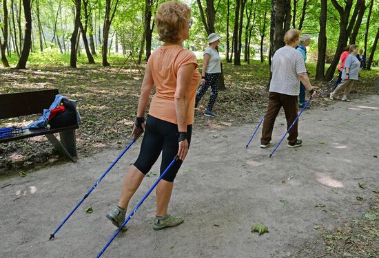 Senior citizens engage in Nordic walking