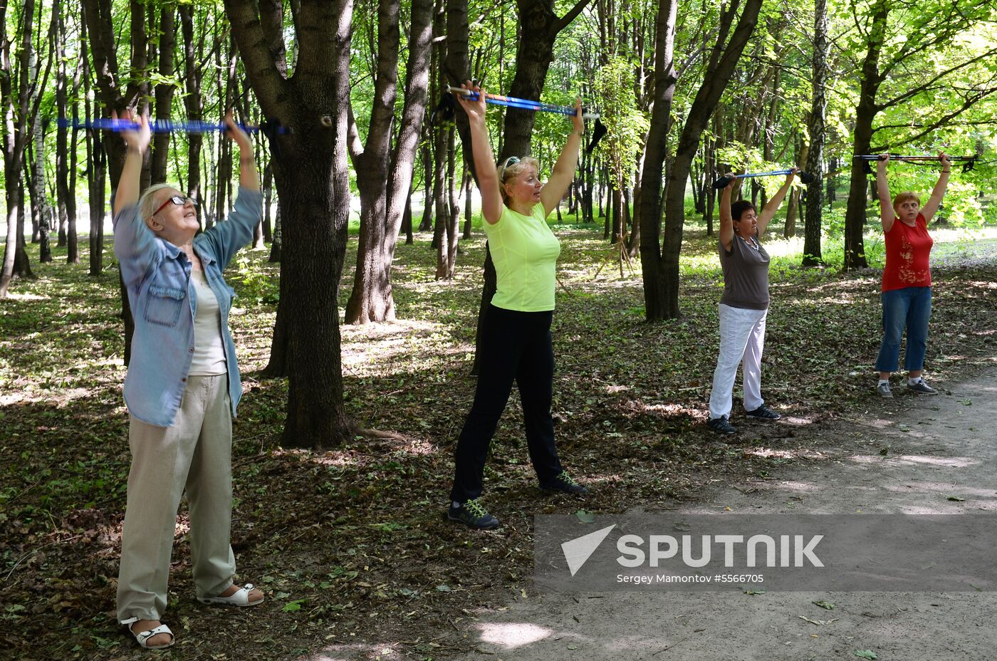 Senior citizens engage in Nordic walking