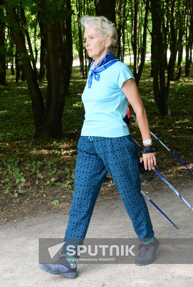 Senior citizens engage in Nordic walking