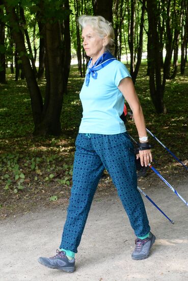 Senior citizens engage in Nordic walking