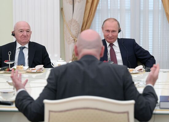 President Vladimir Putin meets with world football legends