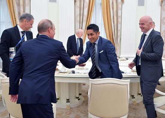 President Vladimir Putin meets with world football legends