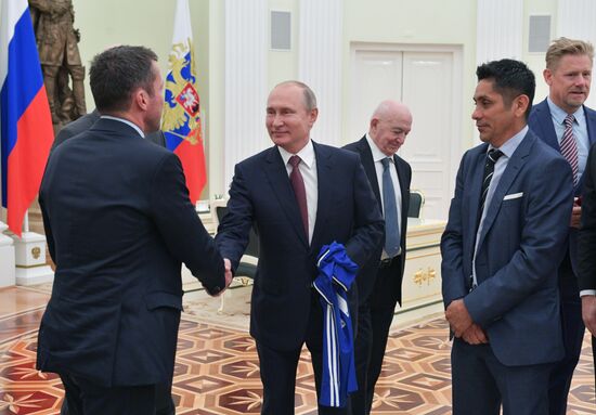 President Vladimir Putin meets with world football legends