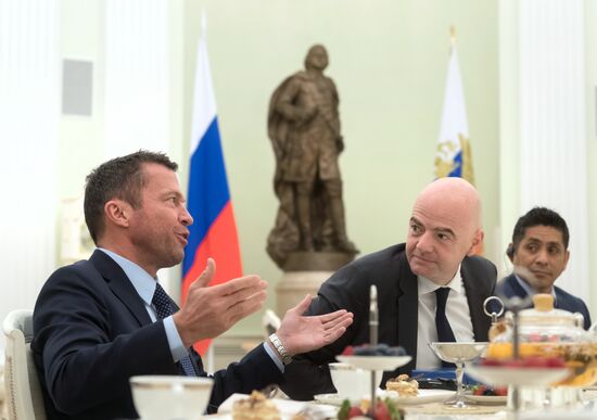 President Vladimir Putin meets with world football legends