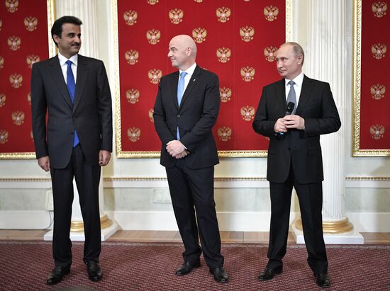 President Putin attends ceremony to hand the World Cup over to 2022 hosts Qatar