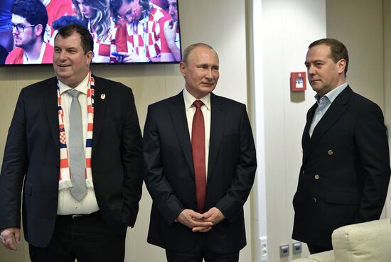 President Vladimir Putin and Prime Minister Dmitry Medvedev attend World Cup final match