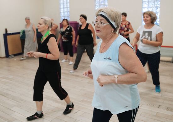 Seniors exercise in a fitness center