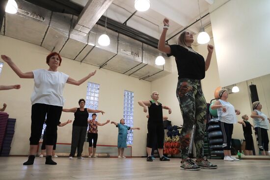 Seniors exercise in a fitness center
