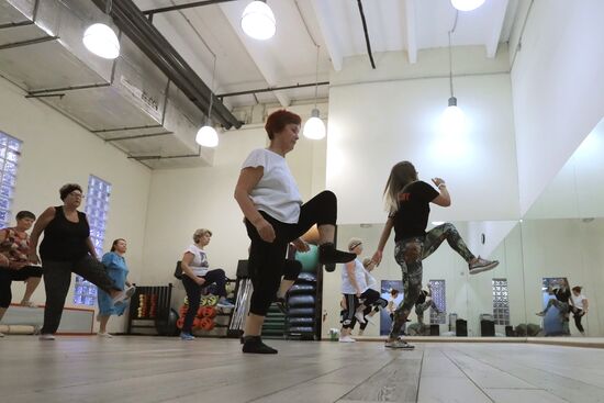 Seniors exercise in a fitness center