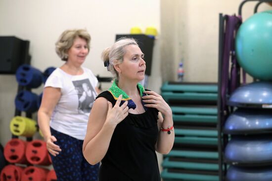 Seniors exercise in a fitness center