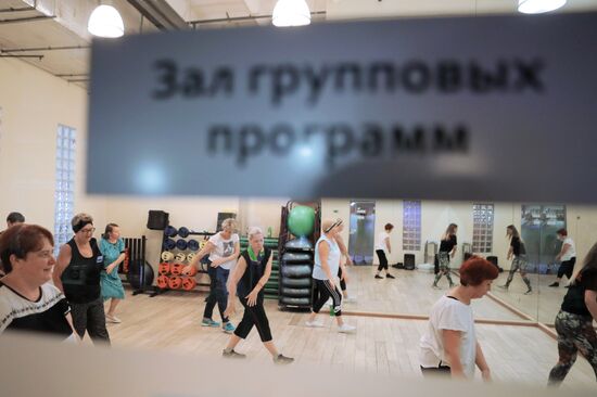 Seniors exercise in a fitness center