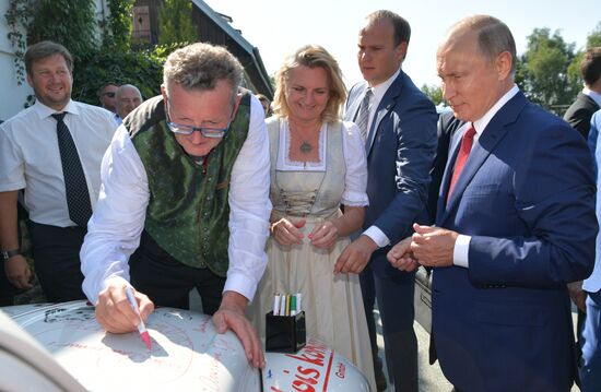 Russian President Vladimir Putin pays a visit to Austria