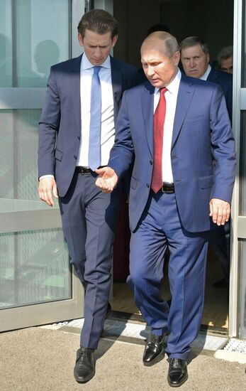 Russian President Vladimir Putin pays a visit to Austria