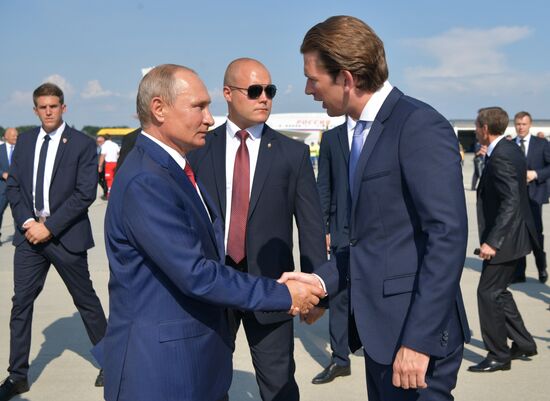 Russian President Vladimir Putin pays a visit to Austria