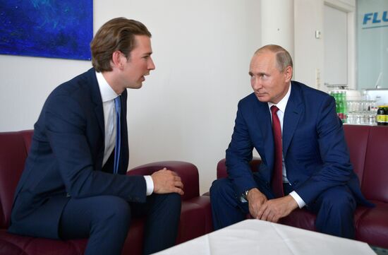 Russian President Vladimir Putin pays a visit to Austria