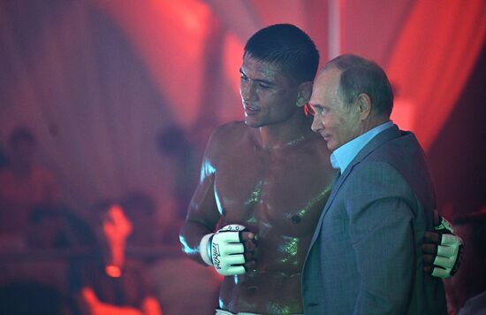 Vladimir Putin attends international combat sambo tournament