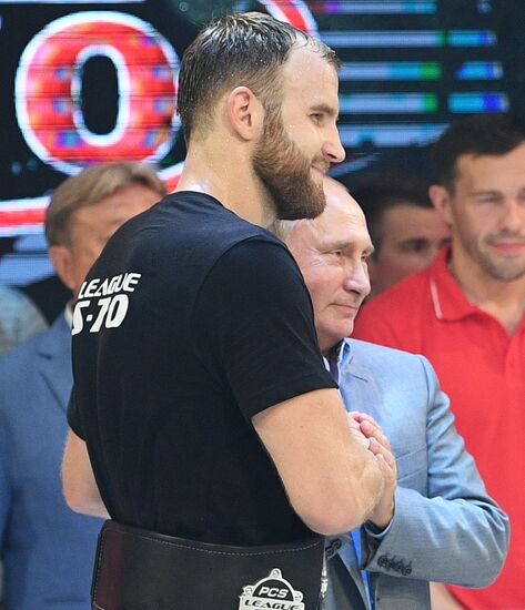 Vladimir Putin attends international combat sambo tournament