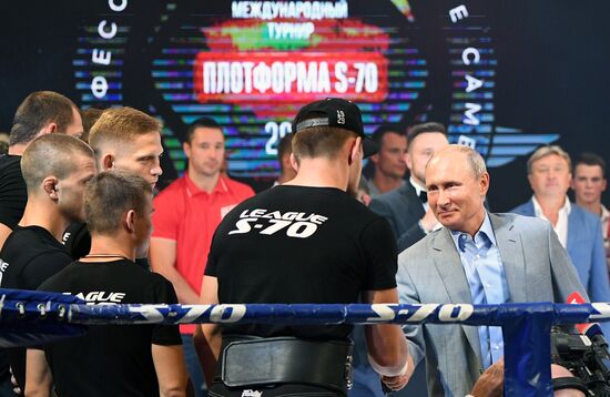 Vladimir Putin attends international combat sambo tournament
