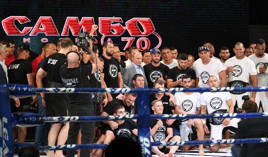 Vladimir Putin attends international combat sambo tournament