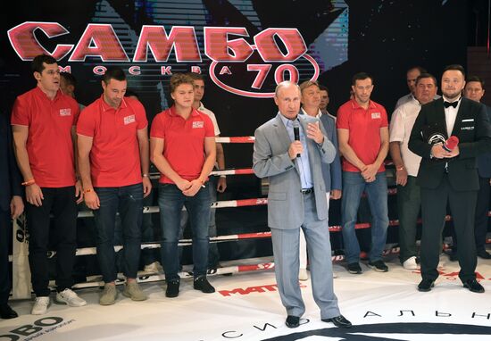 Vladimir Putin attends international combat sambo tournament