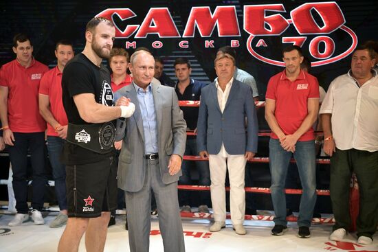 Vladimir Putin attends international combat sambo tournament