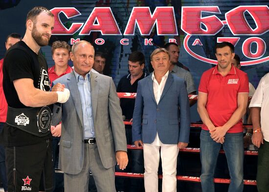 Vladimir Putin attends international combat sambo tournament
