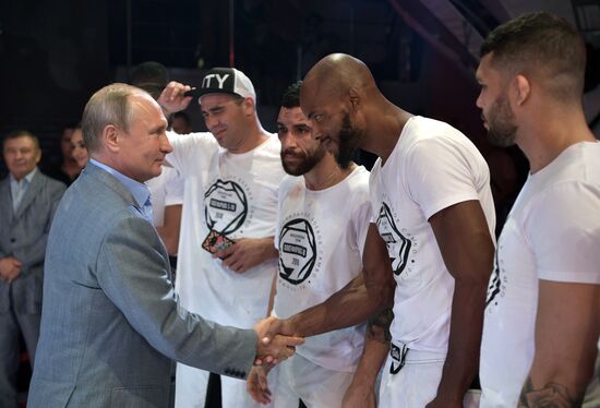 Vladimir Putin attends international combat sambo tournament