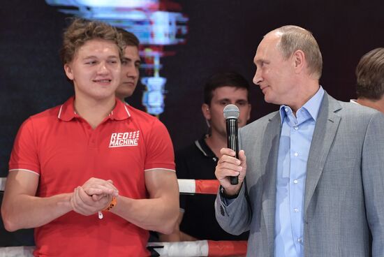 Vladimir Putin attends international combat sambo tournament