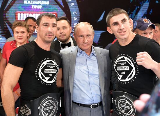 Vladimir Putin attends international combat sambo tournament