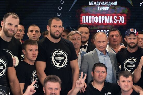 Vladimir Putin attends international combat sambo tournament