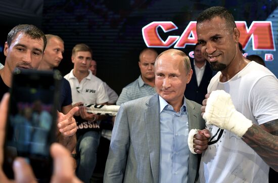 Vladimir Putin attends international combat sambo tournament