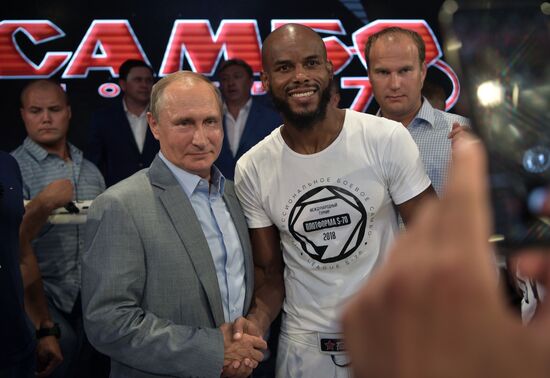 Vladimir Putin attends international combat sambo tournament