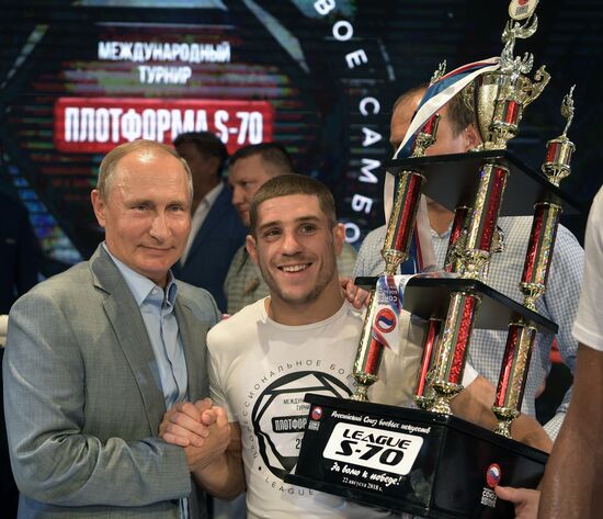 Vladimir Putin attends international combat sambo tournament