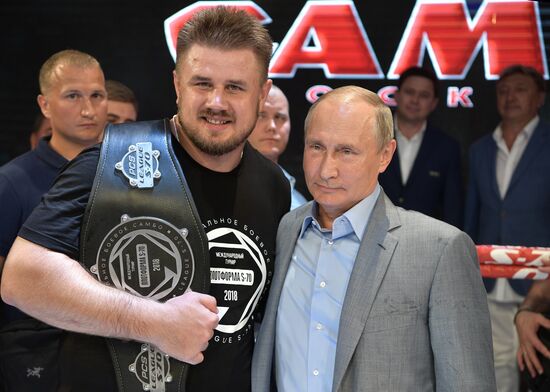 Vladimir Putin attends international combat sambo tournament