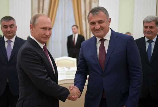 Russian President Vladimir Putin meets with President of the Republic of Abkhazia Raul Khadzhimba and President of South Ossetia Anatoly Bibilov