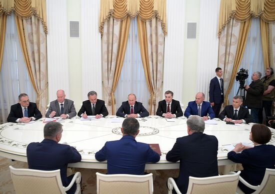 Russian President Vladimir Putin meets with President of the Republic of Abkhazia Raul Khadzhimba and President of South Ossetia Anatoly Bibilov