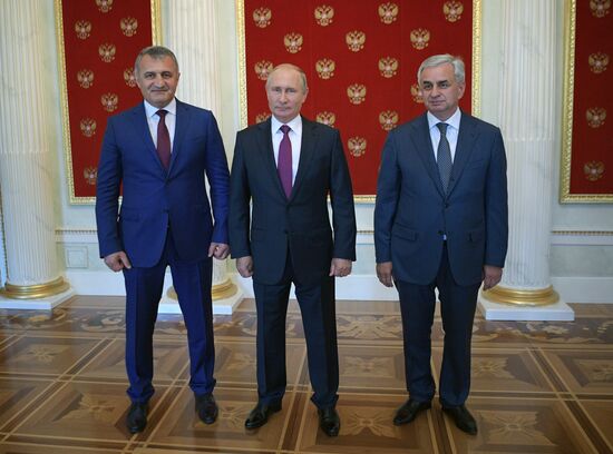Russian President Vladimir Putin meets with President of the Republic of Abkhazia Raul Khadzhimba and President of South Ossetia Anatoly Bibilov