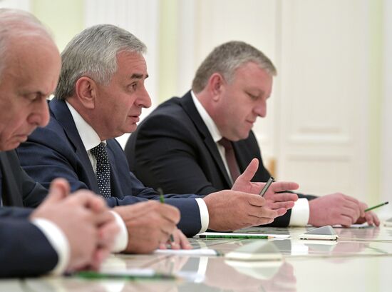 Russian President Vladimir Putin meets with President of the Republic of Abkhazia Raul Khadzhimba and President of South Ossetia Anatoly Bibilov