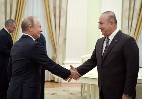 Russian President Vladimir Putin meets with Turkish Foreign Minister Mevlut Cavusoglu