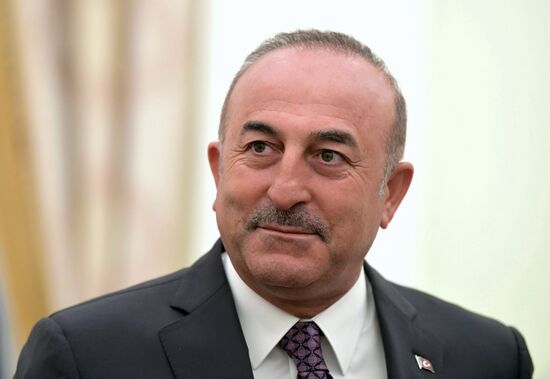 Russian President Vladimir Putin meets with Turkish Foreign Minister Mevlut Cavusoglu