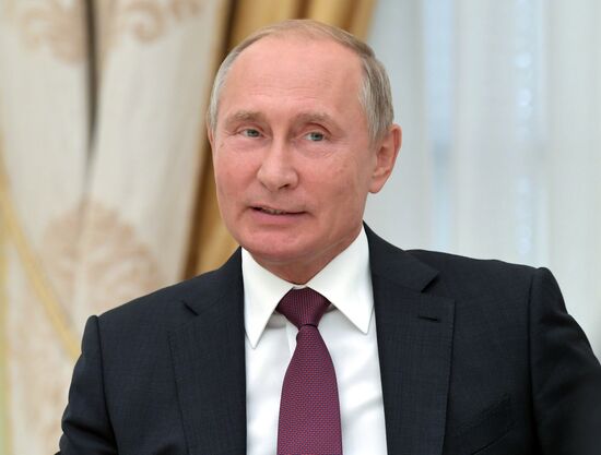 Russian President Vladimir Putin meets with Turkish Foreign Minister Mevlut Cavusoglu