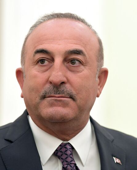 Russian President Vladimir Putin meets with Turkish Foreign Minister Mevlut Cavusoglu